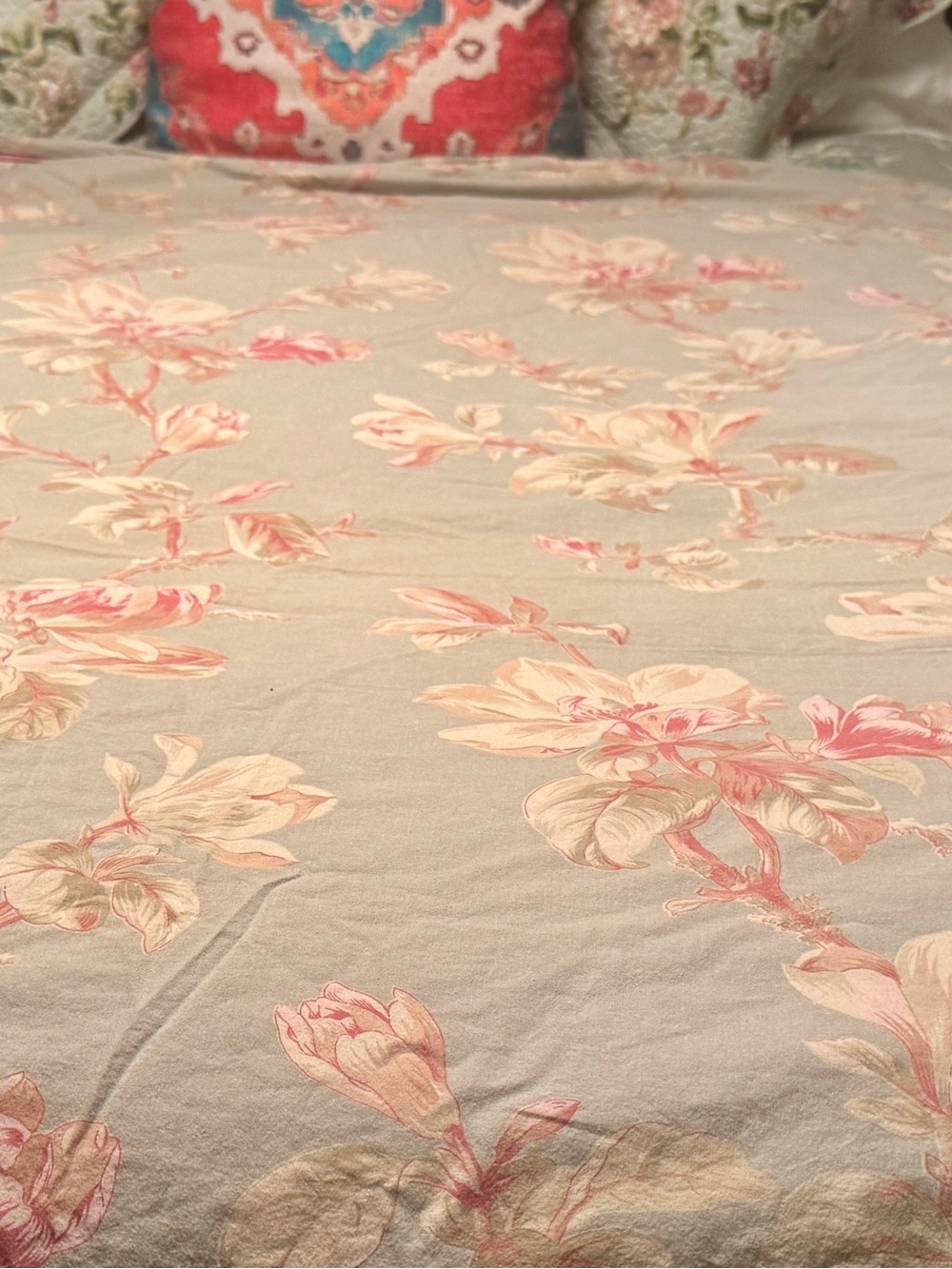 Floral Pastel Duvet Cover on a Light Moss Background with Pink-Coral Piping